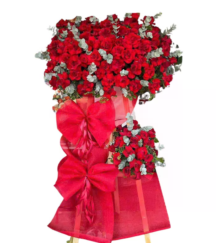 Kệ khai trương đỏ phối trắng, hoa hồng đỏ cùng nơ giấy đỏ