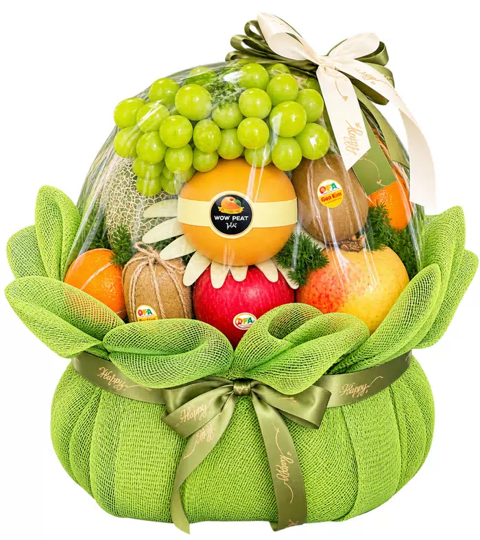 Giỏ trái cây nơ xanh, quả có múi và lưới xanh