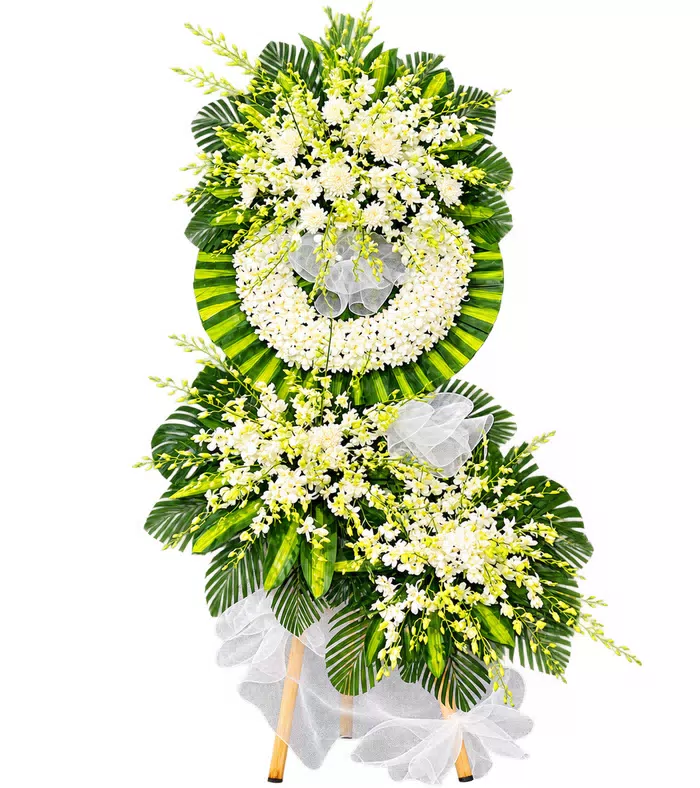 Kệ hoa viếng trắng xanh, lá xanh và vải trắng