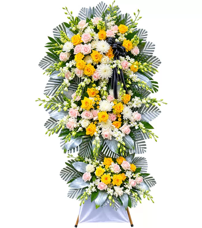 Kệ hoa viếng vàng hồng trắng, lá bạc và vải trắng